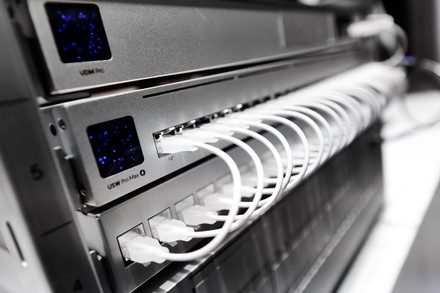 UNS network installation work in a Brisbane comms room